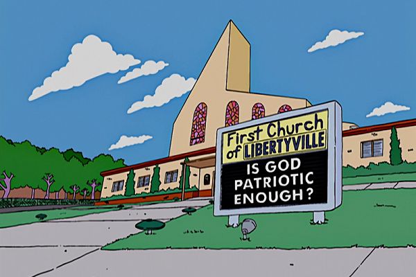 A screenshot from an episode of The Simpsons of a sign outside a church. “First Church of LIBERTYVILLE. IS GOD PATRIOTIC ENOUGH?”