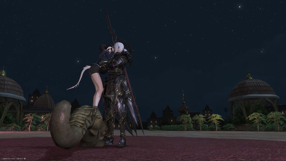 emi standing on a metal elephant sculpture just so she can kiss estinien at his height