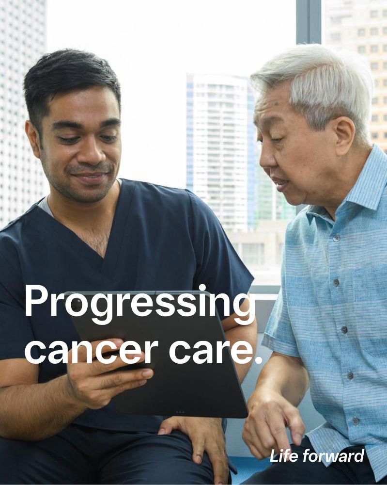 A young man shows a tablet screen to an older man. The headline says "Progressing cancer care." and on the bottom right "Life forward".