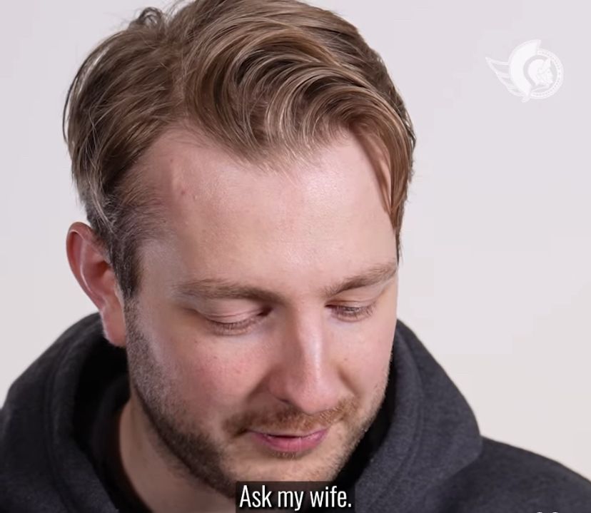 Picture of Ullmark in the same pose as the first one, but zoomed in more. The caption at the bottom says “Ask my wife.”