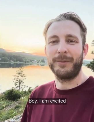 Linus Ullmark stands in front of a river as the sun is just starting to set. He’s wearing a dark red shirt. The caption at the bottom says “Boy, I am excited.”