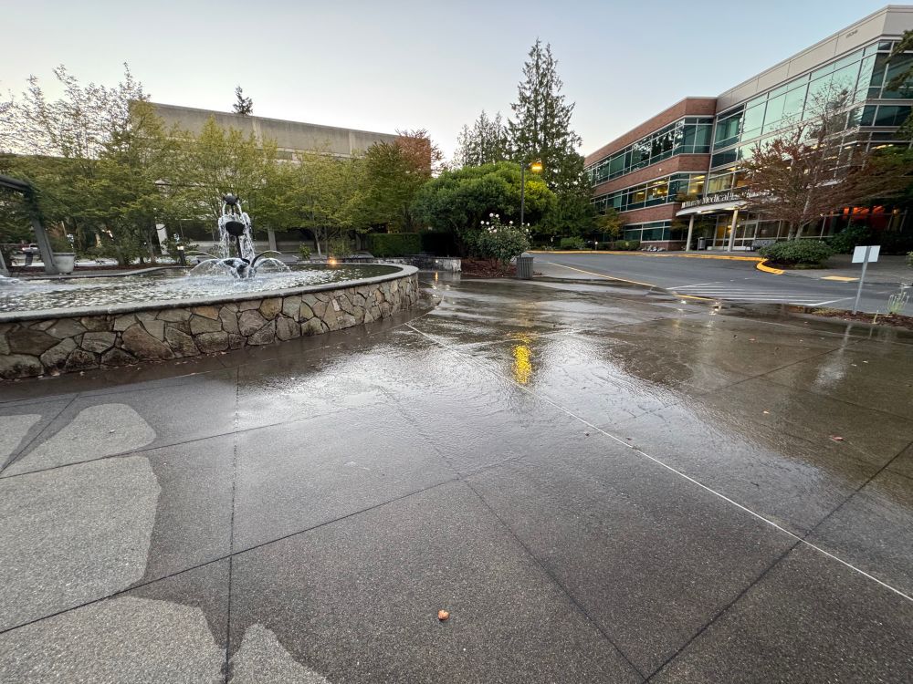 A photo of the NWH fountain showing it is leaking out the sides on your concrete. 