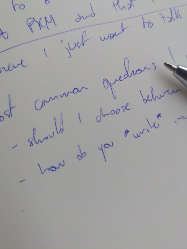 Zoomed in picture of my notebook, where on focus there's the word "write" enclosed in asterisks. In markdown, it would be italic.
