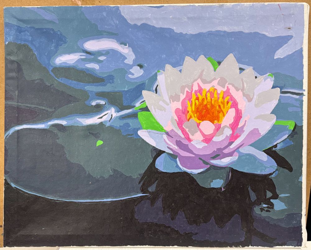 A color cellphone photo: a painting of a water lily floating on the gently dappled surface of a pond. This painting was available for purchase on 6 Aug 2025 at the Goodwill thrift store at 5555 N Lamar Blvd, Austin. 