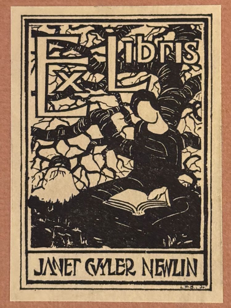 A bookplate depicting a woman (with a blank face) sitting under a tree reading a book (with blank pages). Text reads: “Ex Libris Janet Cuyler Newlin.” Pasted inside the front cover of: Otto F. Ege. Pre-Alphabet Days. Decorations and Frontispiece by Edward D. Edwards. (Baltimore: Norman T.A. Munder & Co., Inc., 1923).