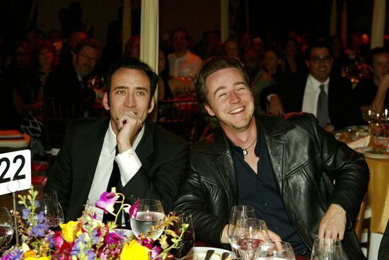 At a dinner table sits Nicolas Cage (who swaps faces with John Travolta in Face/Off) and Edward Norton (who turns out to be Brad Pitt's Tyler Durden in Fight Club) and John Cena (who you can't see)