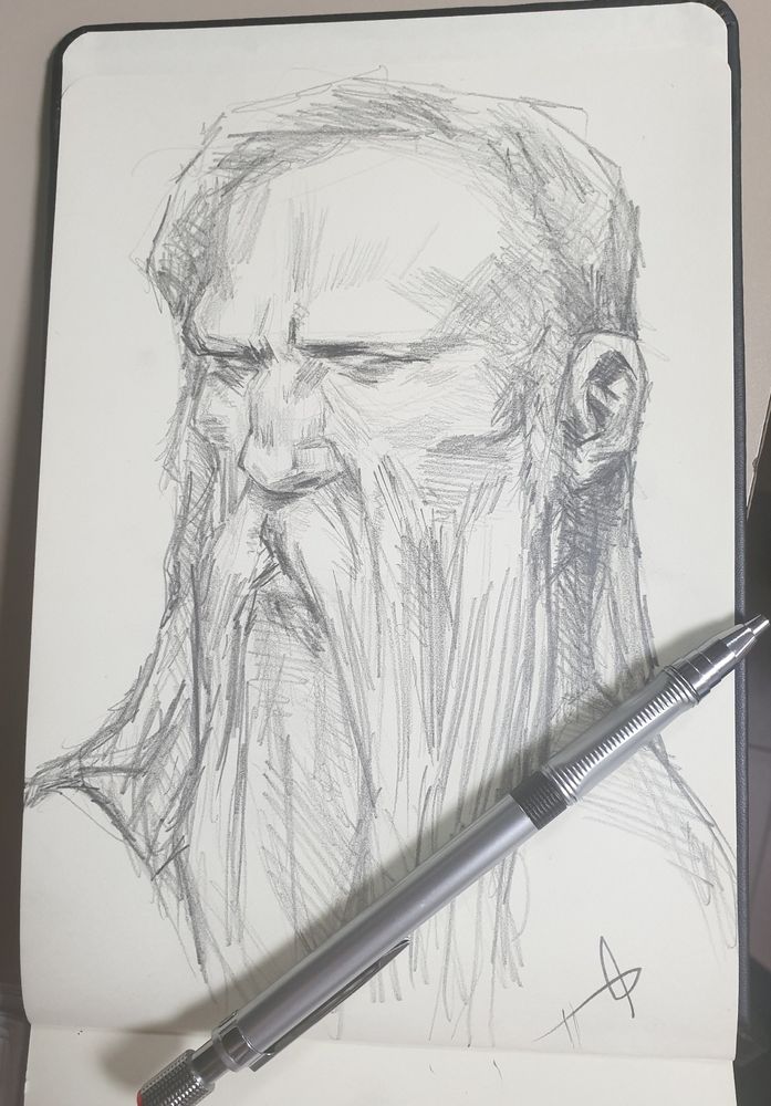 Rostro esbozado de un hombre de mediana edad de barba luengo y lisa con los rasgos endurecidos, que porta cierta gravedad en la mirada. 