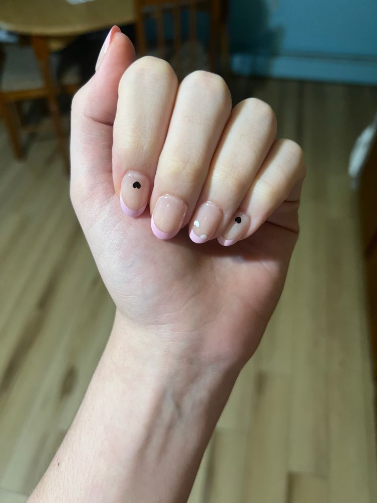 another picture of bunni’s nails they have their hand closed to show the nails 