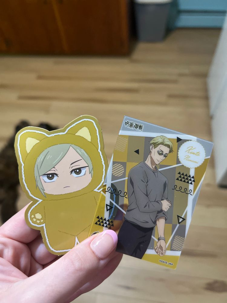 a picture of the nanami plush as a sticker and nanami’s photo card