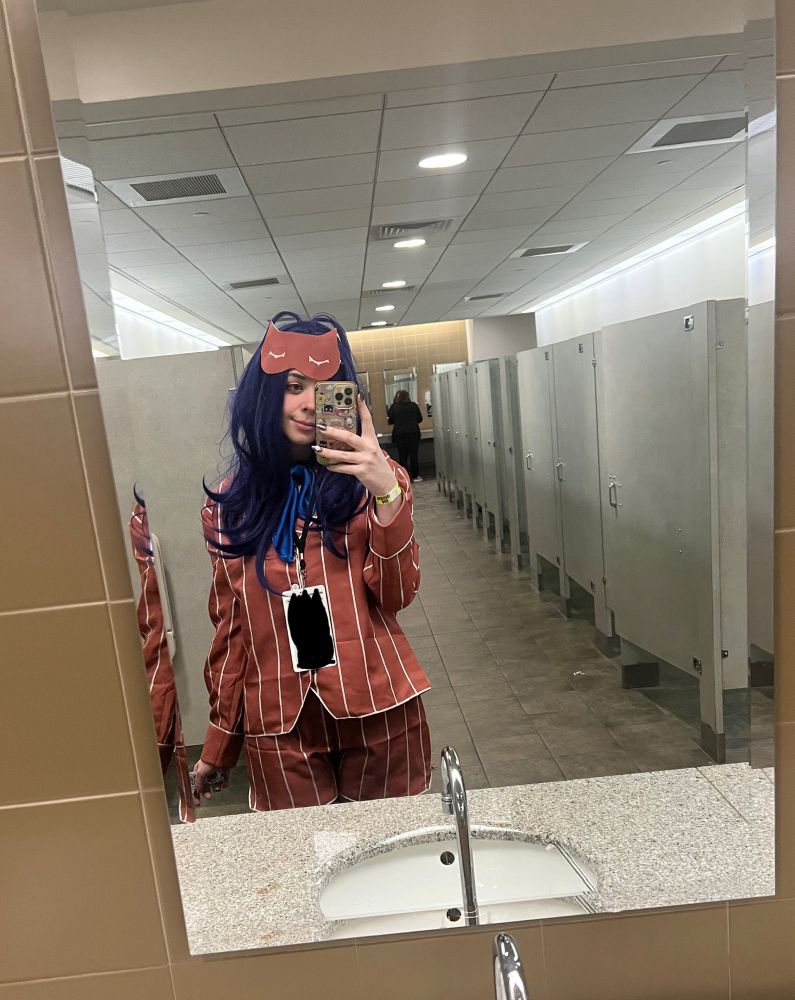 a picture of bunni in a bathroom mirror at the con in their mita cosplay 