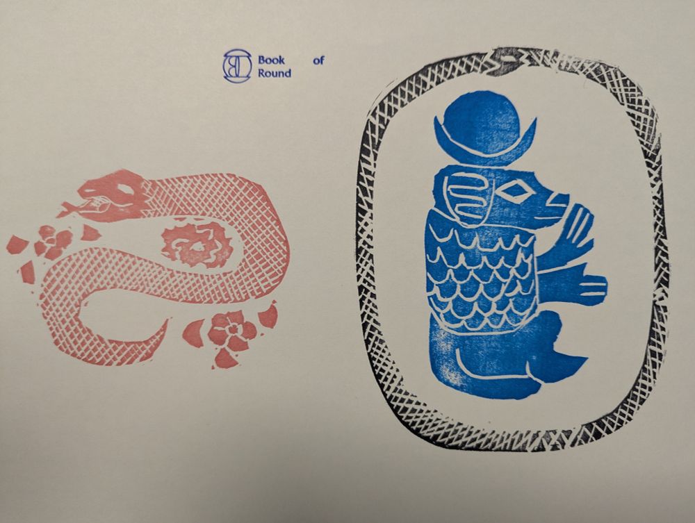 A serpent stamped in red next to an Orobouros in black around a Blue stamp of Thoth with moon and solar disc above its head