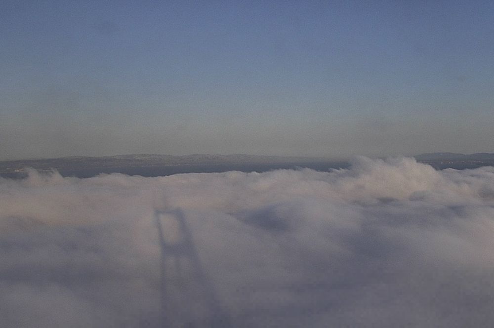 The shadow of Sutro Tower on fog on an early summer evening. 

The fog is named Karl. They are in a long term non-exclusive situationship. It's pretty intense this year.