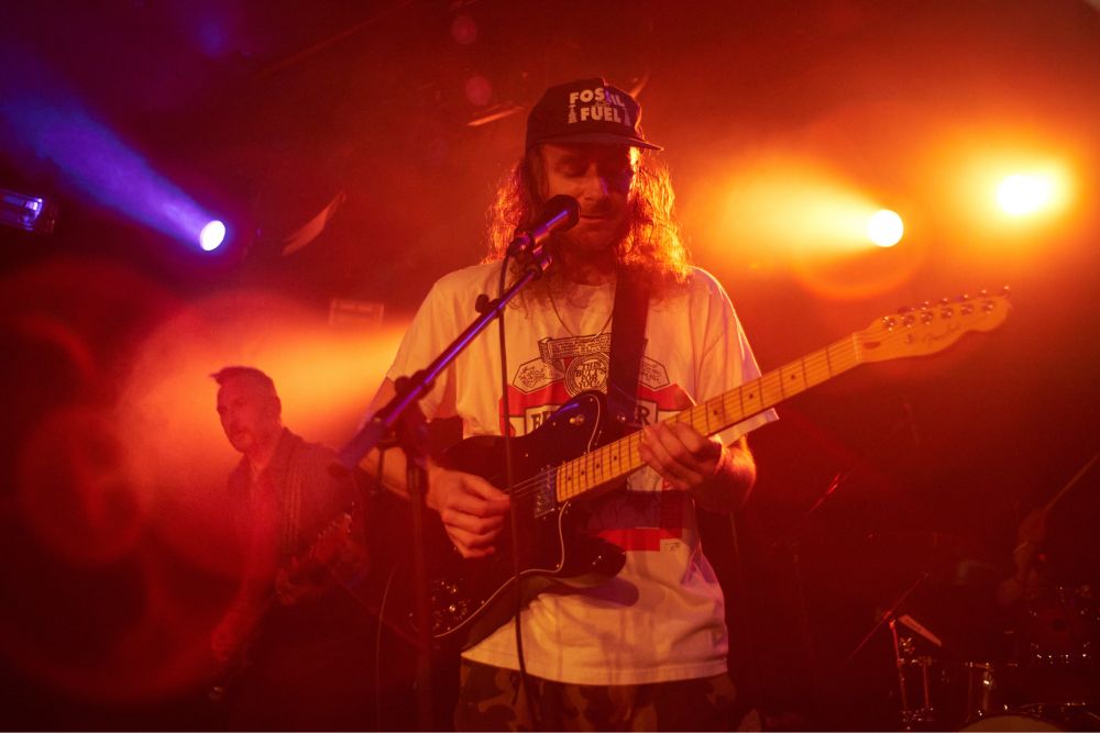 Dylan Rau on guitar and Val Loper on bass. Shot with an early 70’s Nikkor S adapted onto a Sony A7. The focal length is 35mm and one of the lens flares looks like a smile emoji.