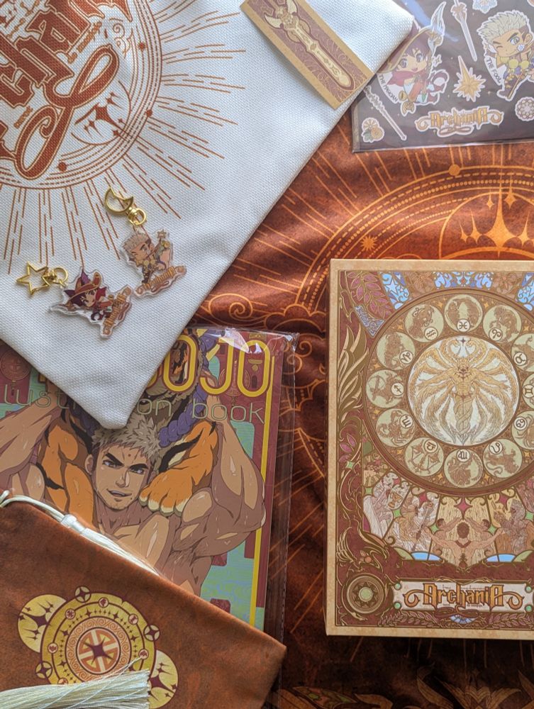 Collection of items from the Archania tarot featuring: tote bag, table cloth, keychains, bookmark, card bag, and deck box 