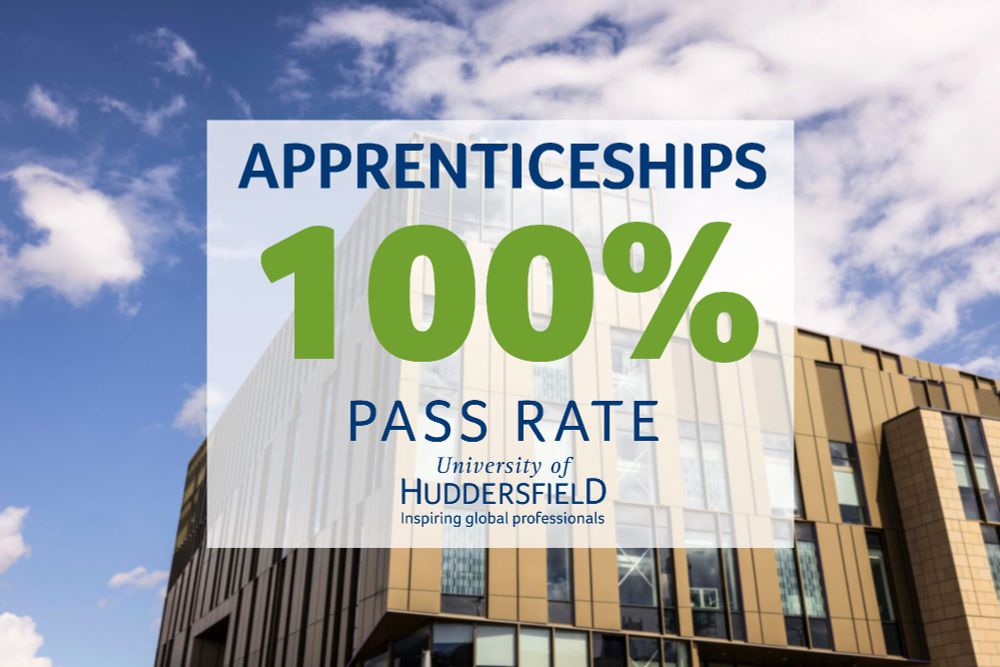 Banner reading 'Apprenticeships 100% Pass Rate' in front of the University of Huddersfield building under a clear blue sky.
