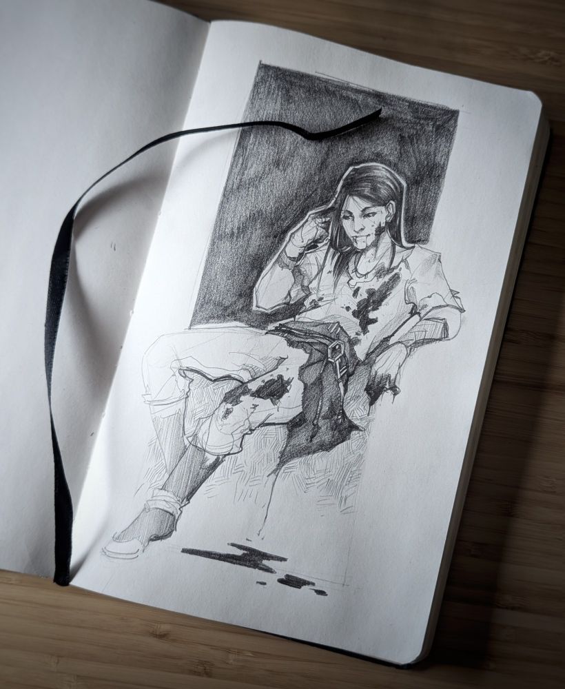 A pencil sketch in a Moleskine journal, featuring a bloody male vampire.