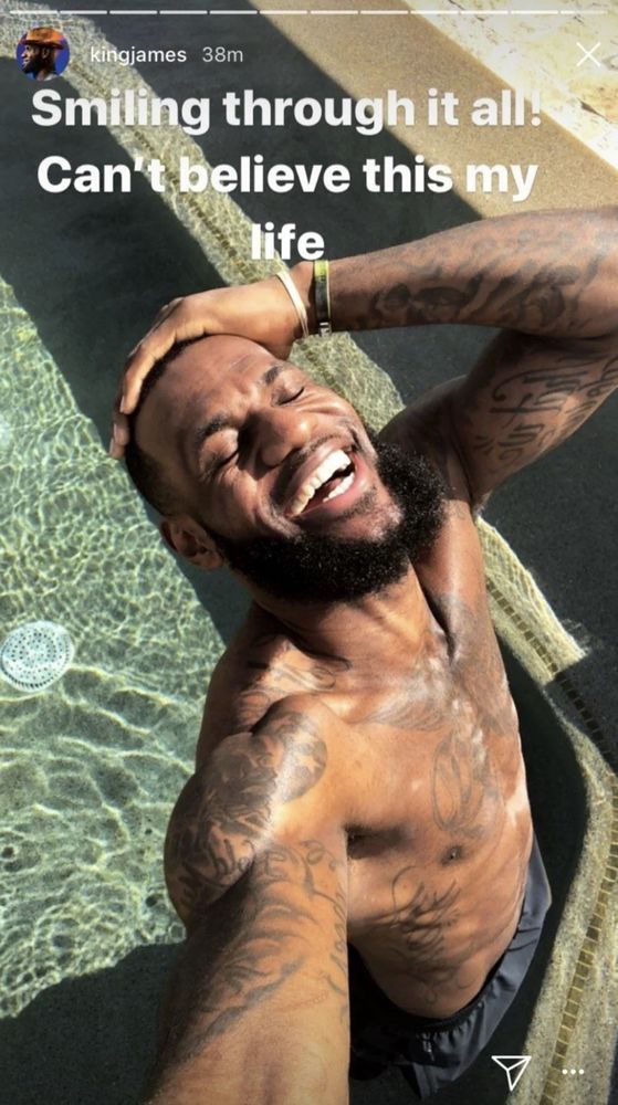 meme of Lebron James smiling in a pool with the caption “smiling through it all can’t believe this my life”