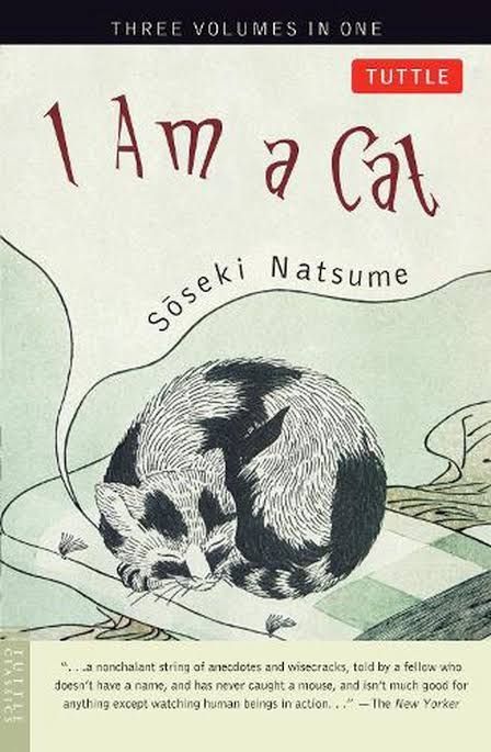 Cover of the novel "I Am a Cat" by Sōseki Natsume. The artwork shows a black and white cat snoozing on a folded checkered sheet.