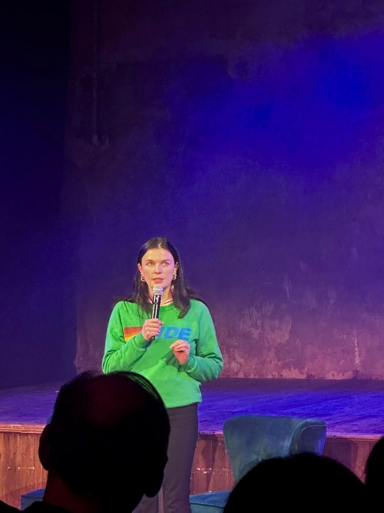Comedian Aisling Bea performing on stage.