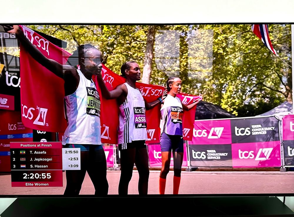 The top three elite female finishers of the London Marathon pose for photographers