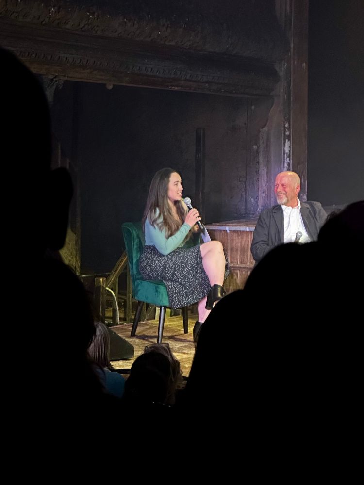 Wildlife presenter Megan McCubbin on stage with a panel of guests