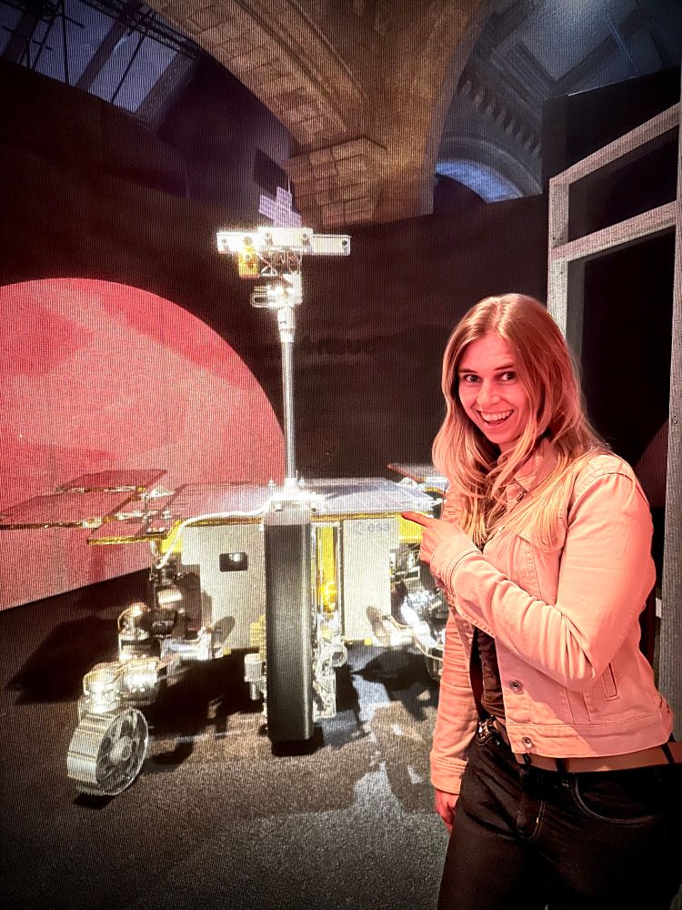 Emma stands in front of the replica Mars rover at the Natural History Museum.