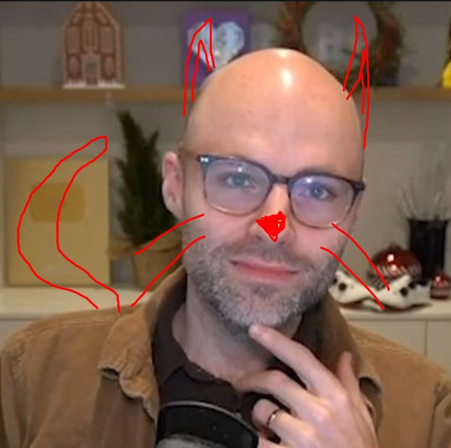 northernlion doing the chin thing but he's got badly drawn cat nose and whiskers and ears and tail drawn on top