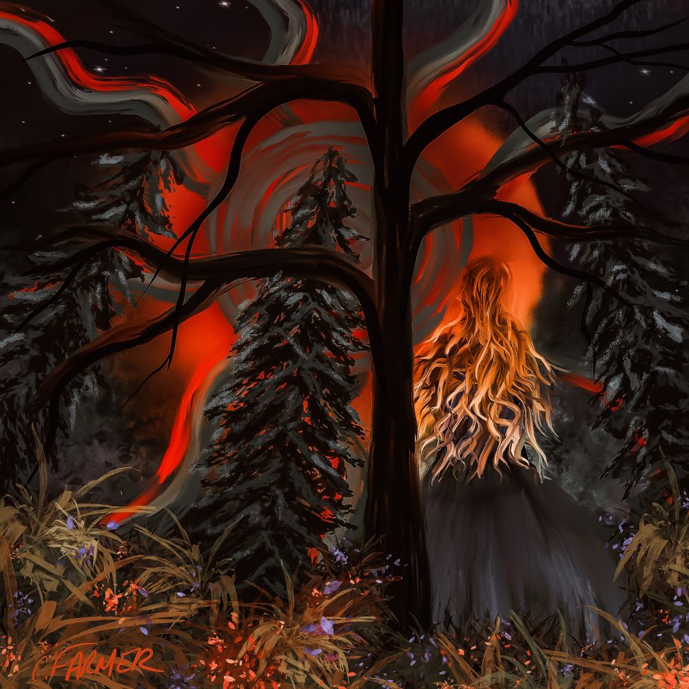 A woman standing in the forest looking at the glowing orange night sky. 