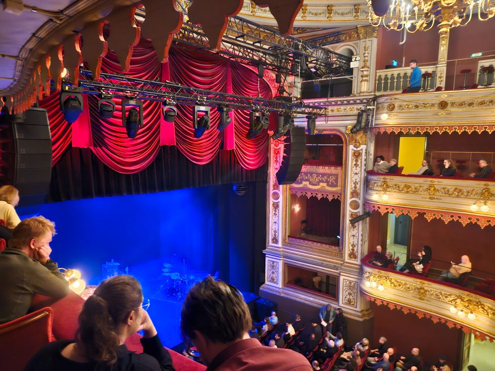 view from a second balcony theatre seat with only a small part of the stage in view (notably: not the piano...) 