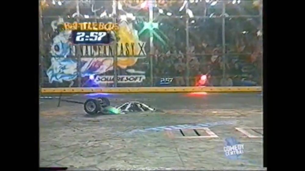 screenshot from battlebots season 4 toe crusher vs low blow? there's a HUGE final fantasy x decal on the side of the battlebox.
