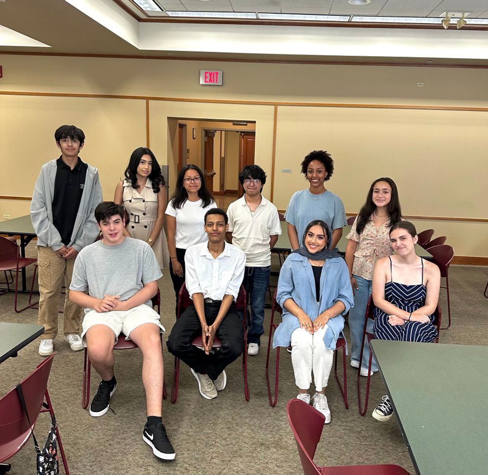 Bushra sitting with 10 high school student leaders who want to engage with her congressional campaign 