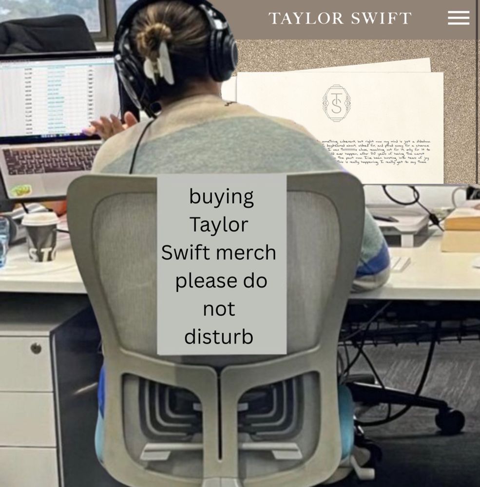 person sitting on a text. a piece of paper on the back of the chair says “buying Taylor swift merch do not disturb”