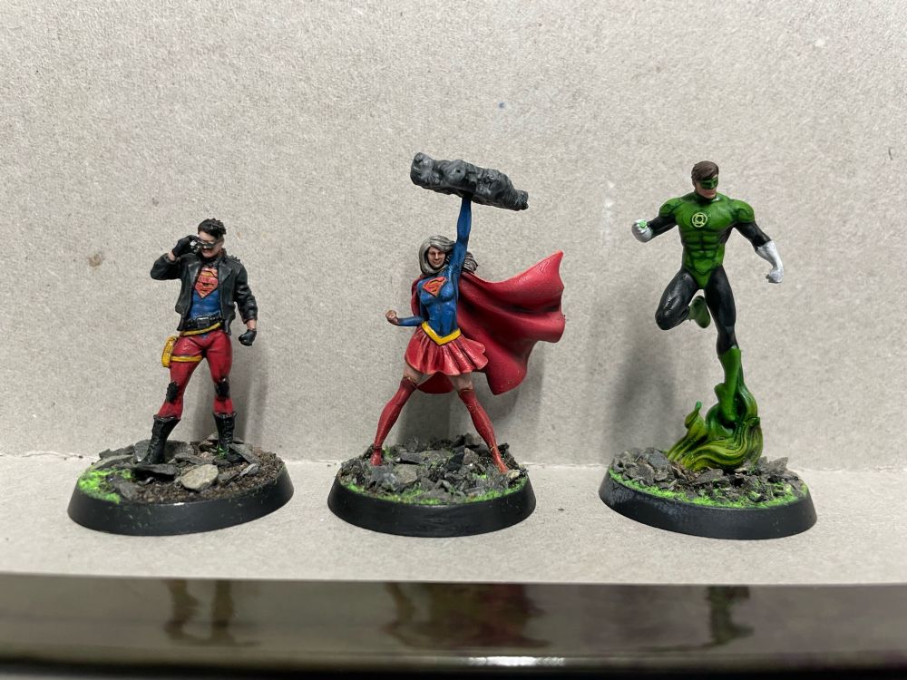 Superboy, Supergirl and Green Lantern Hal Jordan miniatures.