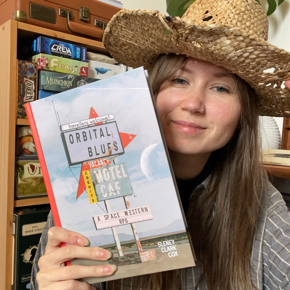 Me dressed up as a cowboy wearing a cowboy hat & holding Orbital Blues by SoulMuppet. 