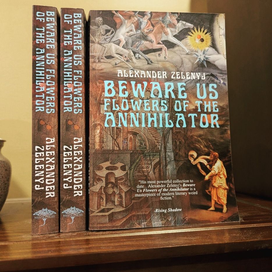 Three paperback copies of Alexander Zelenyj's anthology Beware Us Flowers of the Annihilator sit on a shelf.