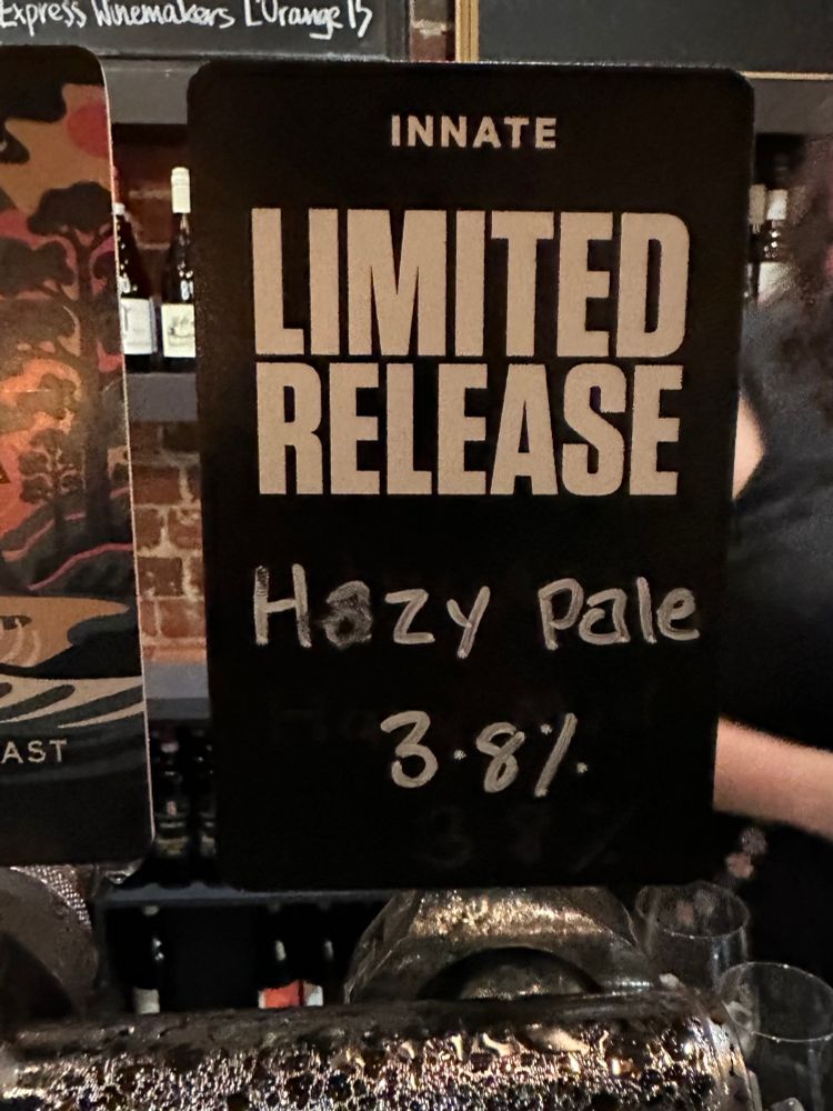 A sign above a beer tap that reads, “Hazy Pale”. See, it’s funny because