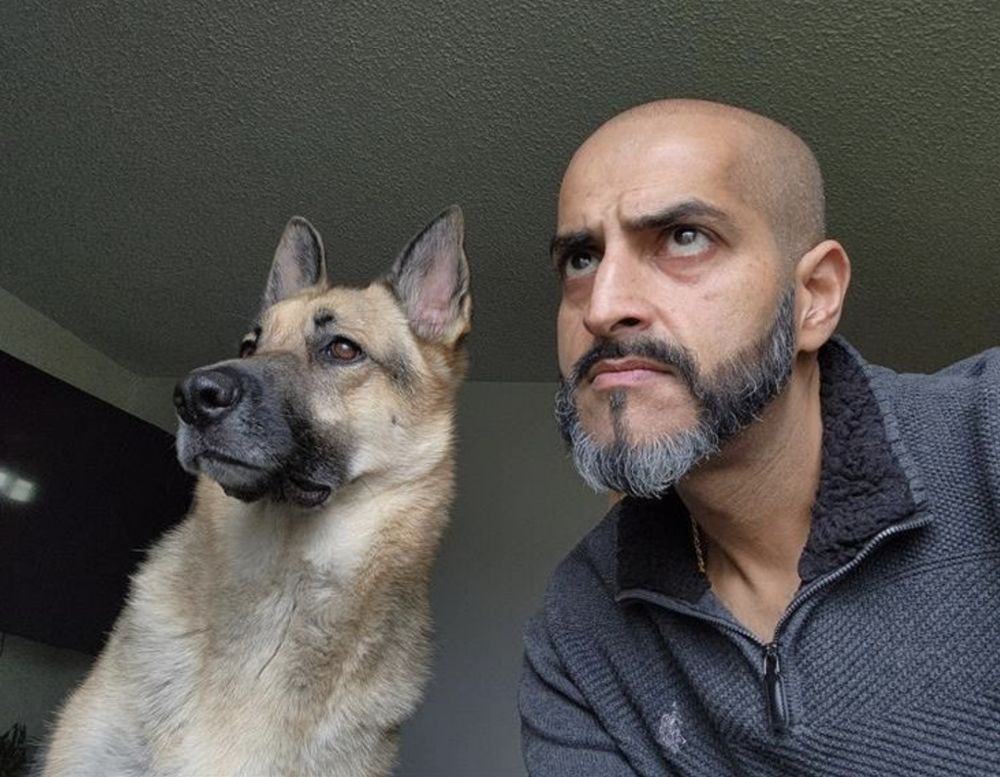 A photo of Ajay Rai with his German Shepherd dog. 