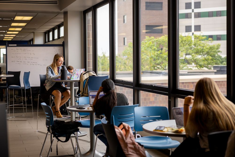 Students gather in a study space on campus. 