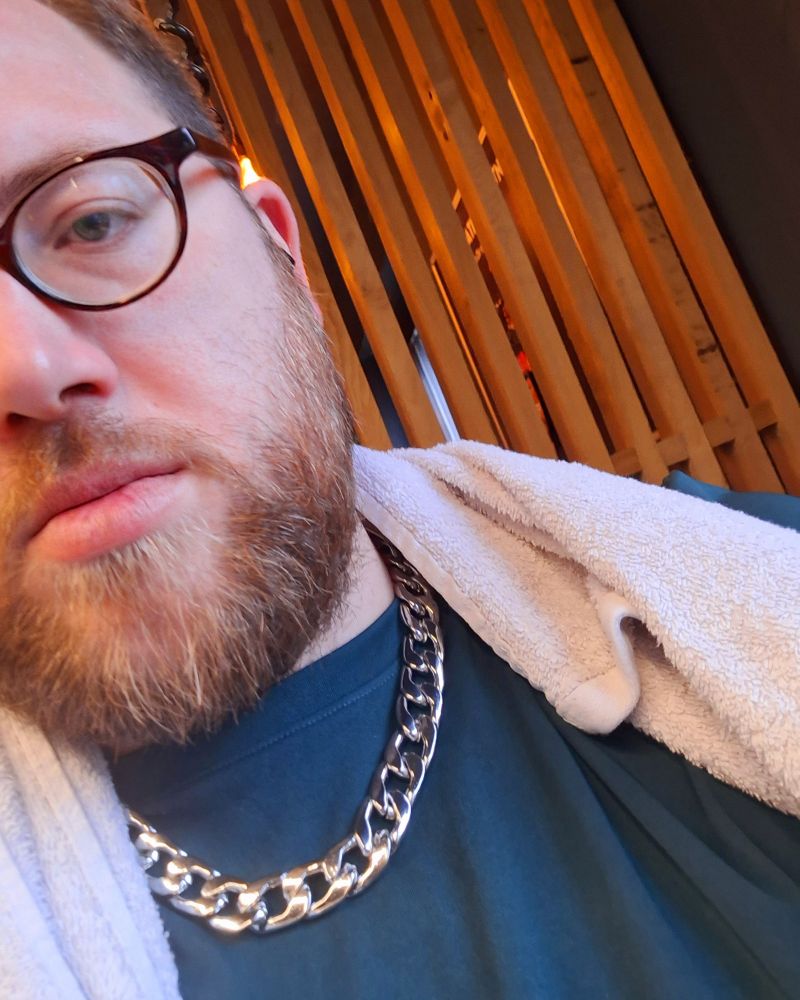 Me with a big silver necklace at the gym