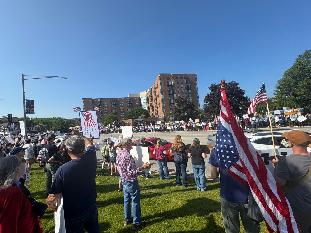 People lined up on both sides of Northwest Highway in Arlington Heights for several blocks. 