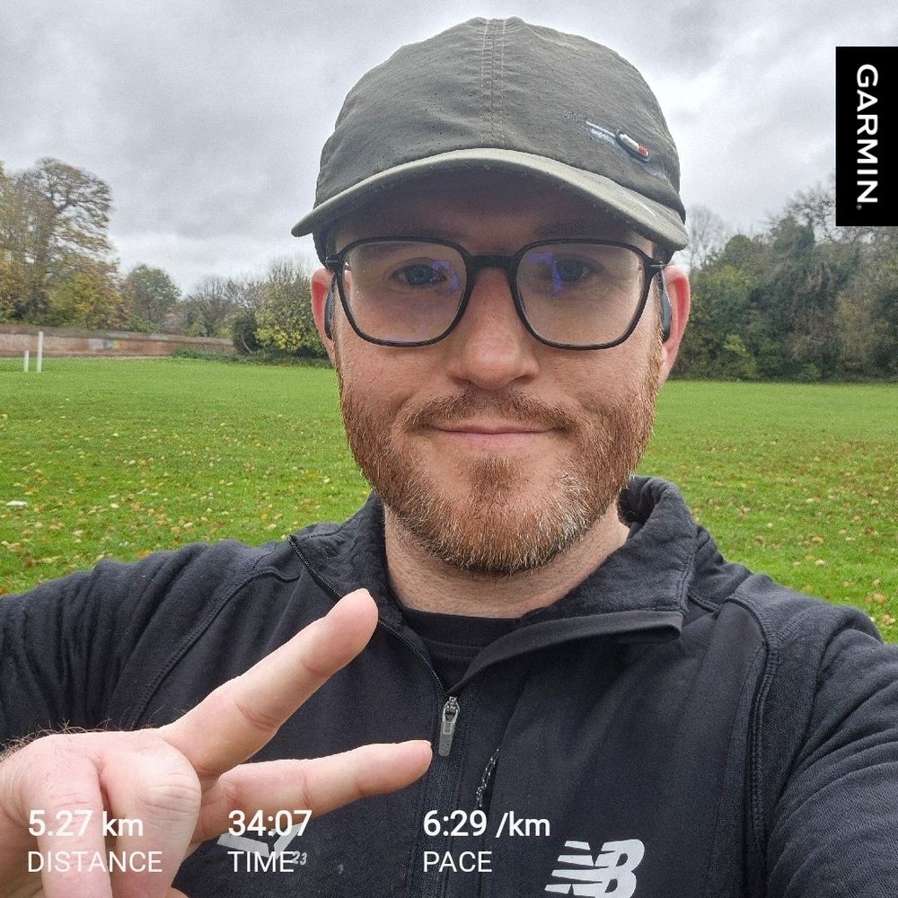 Me throwing up a peace sign post run 