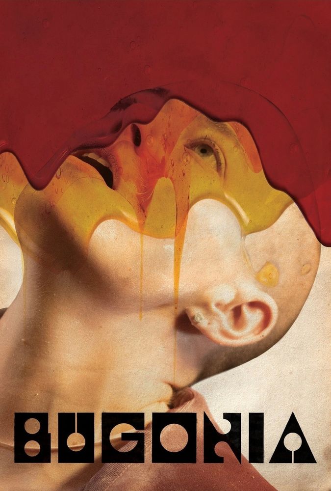 A bald woman staring upwards as a sheet of blood comes down