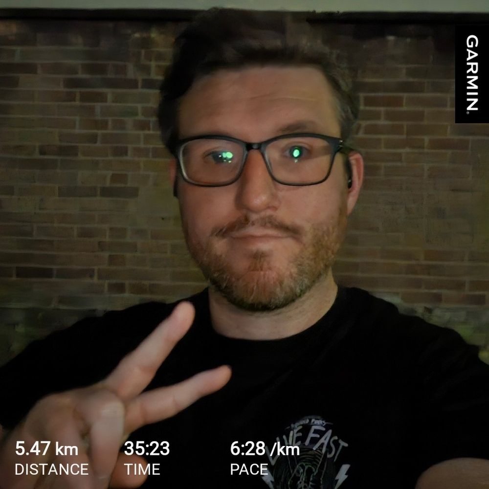 Me throwing up a peace sign post run 