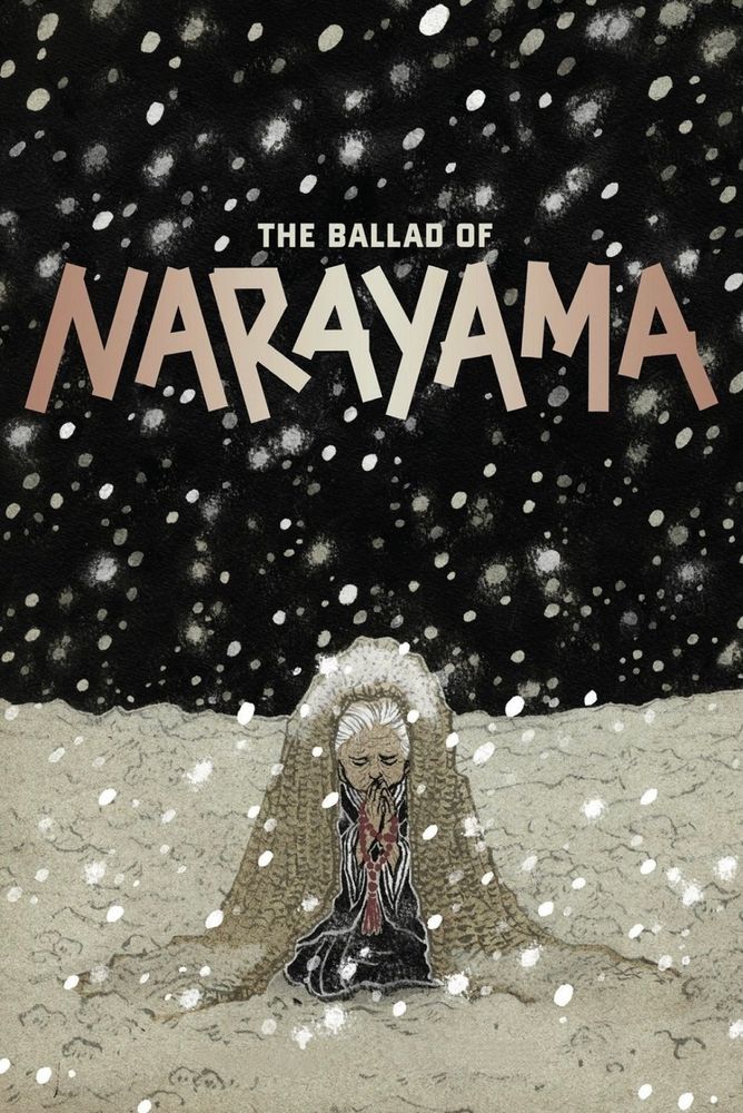 An old lady kneeling down with red beads looking as if in prayer. She has a white cloak on and is being covered in snow