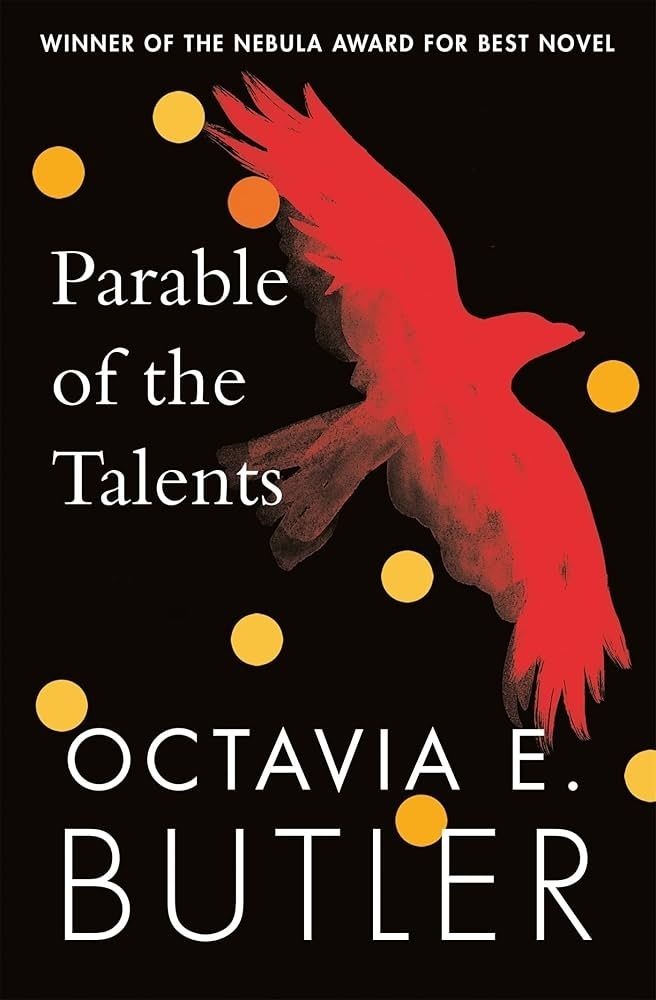 A black background with a red bird flying spots of yellow around the cover