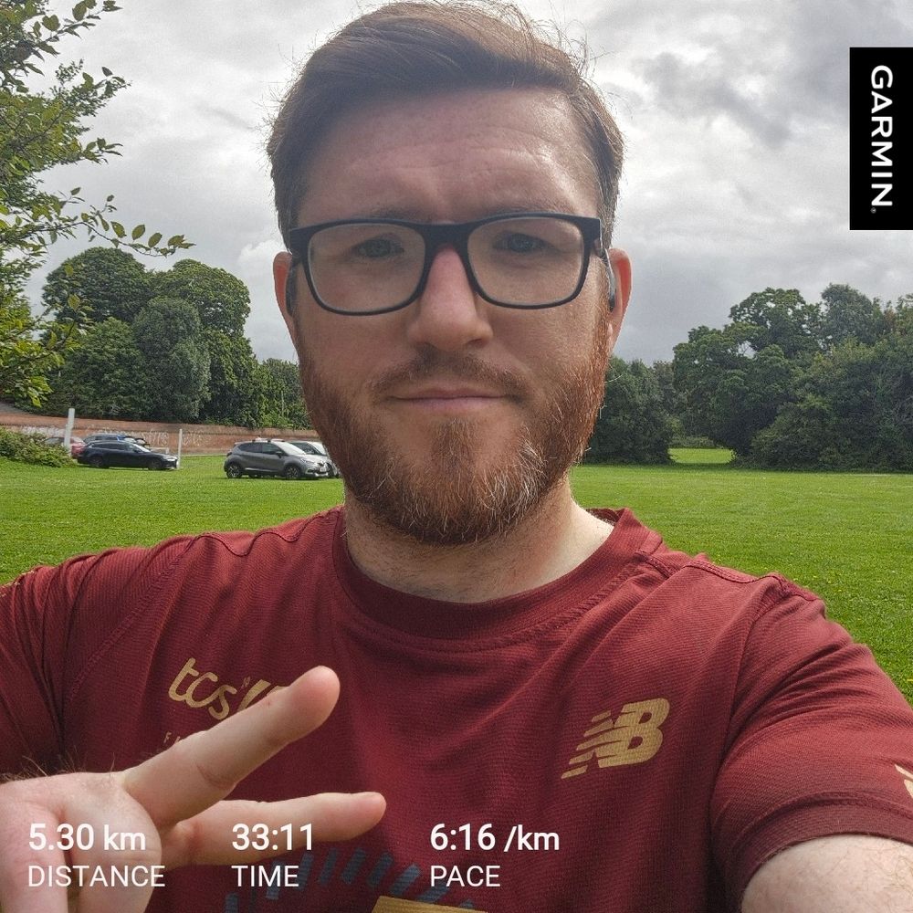 Me throwing up a peace sign post run 
