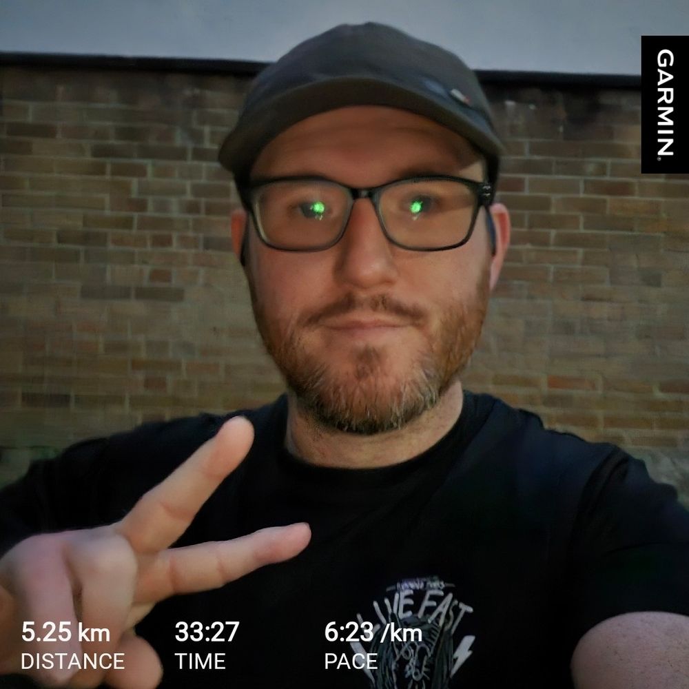 Me throwing up a peace sign post run 