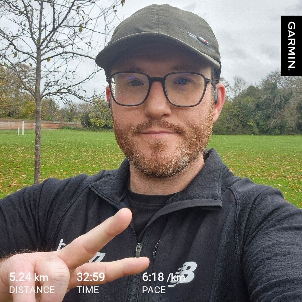 Me throwing up a peace sign post run 