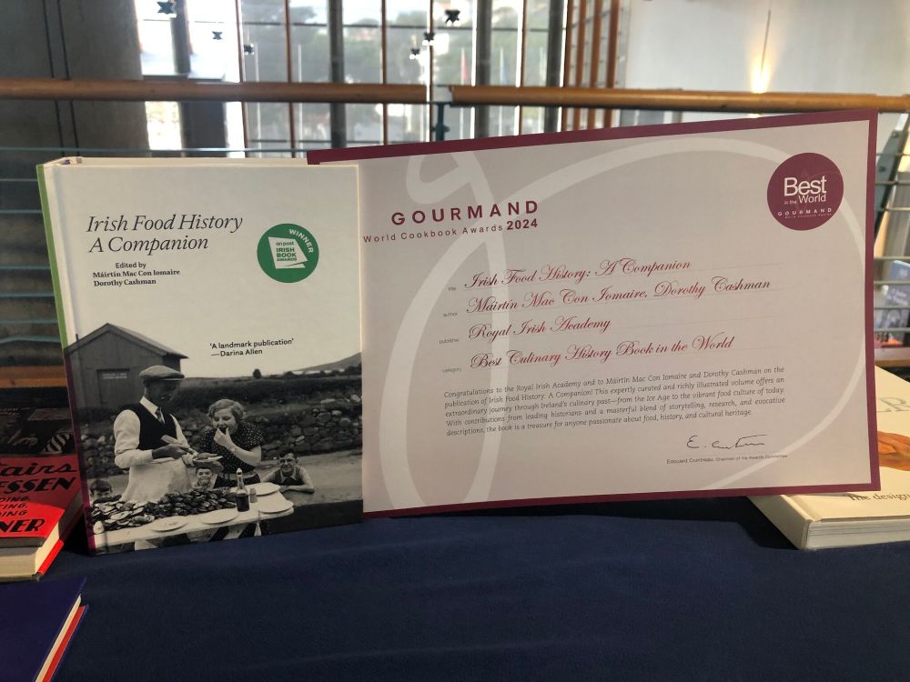 image of Irish Food History a Companion book alongside the book award for Best Culinary History Book in the World awarded by the Gourmand World Cookbook Awards 2024