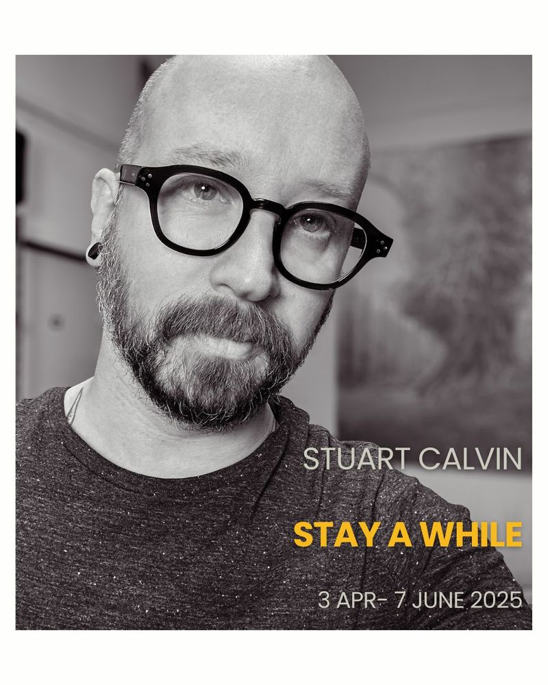 A black-and-white portrait of a person with glasses and a beard, looking into the camera with a calm expression. Text reads: "Stuart Calvin, Stay A While, 3 Apr–7 June 2025."
